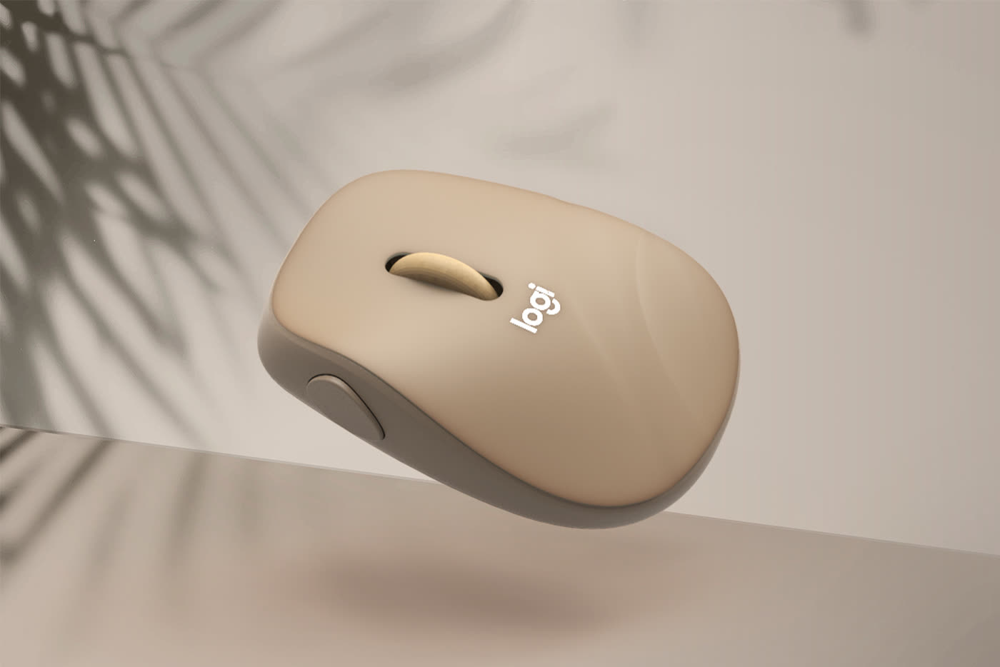 Sand-coloured Logitech mouse floating in warm window light