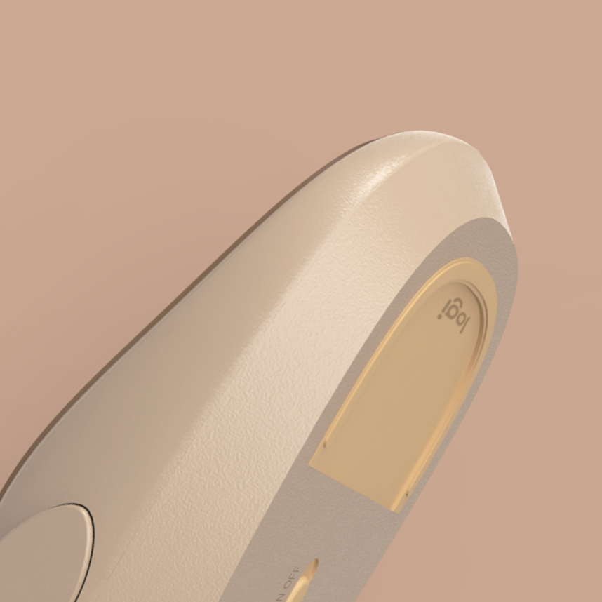 Close-up of the sand-coloured mouse underside, battery cover and shell texture